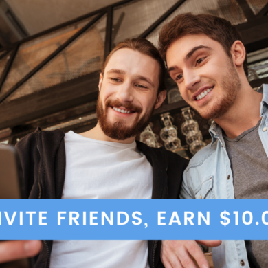 Two young men looking at phone and smiling with the text Invite Friends, Earn $10