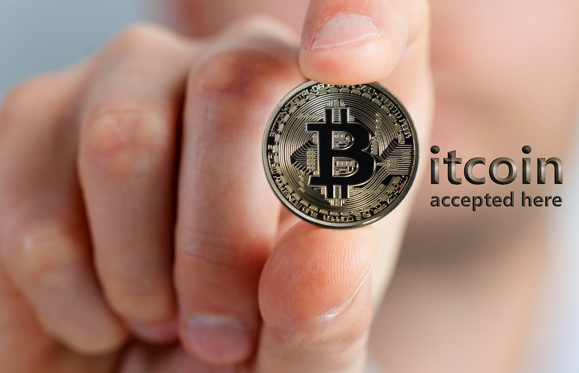hand holding a bitcoin